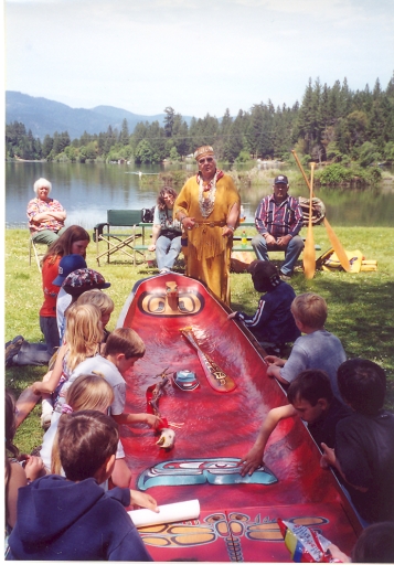 Aggie teaching about Takelma ways with the traditional canoe made by Gray Eagle and George Fence