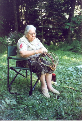 Aggie weaving an egg basket at the Good Medicine Women's Healing Gathering in Williams, 2004