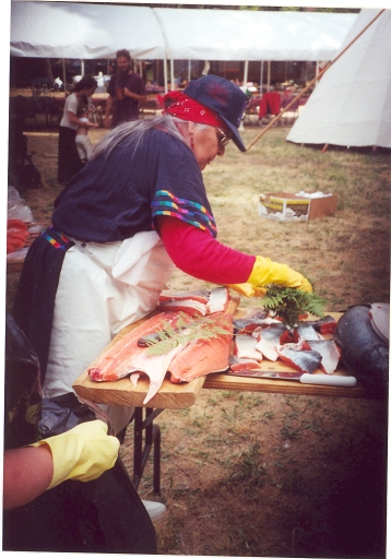 Aggie cleaning salmon with ferns at Applegate Salmon Ceremony, mid-1990s