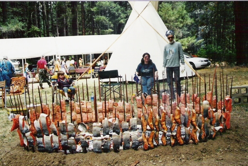 Daughter Mona Hudson and Barry Snitkin tending salmon skewers